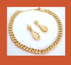 Trifari Plastic Coral Necklace and Earrings Signature